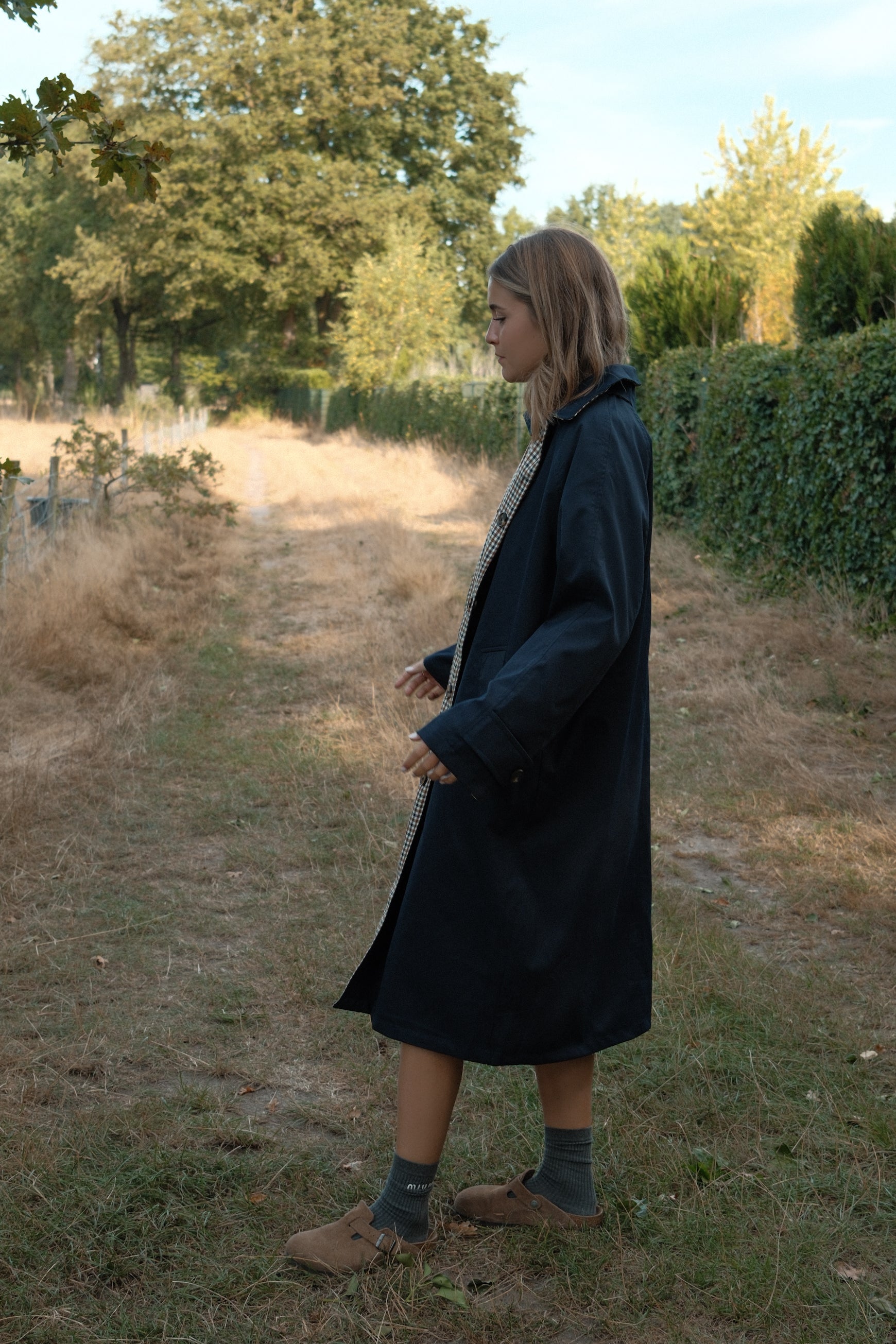THE REVERSIBLE CHECK TRENCH COAT NAVY