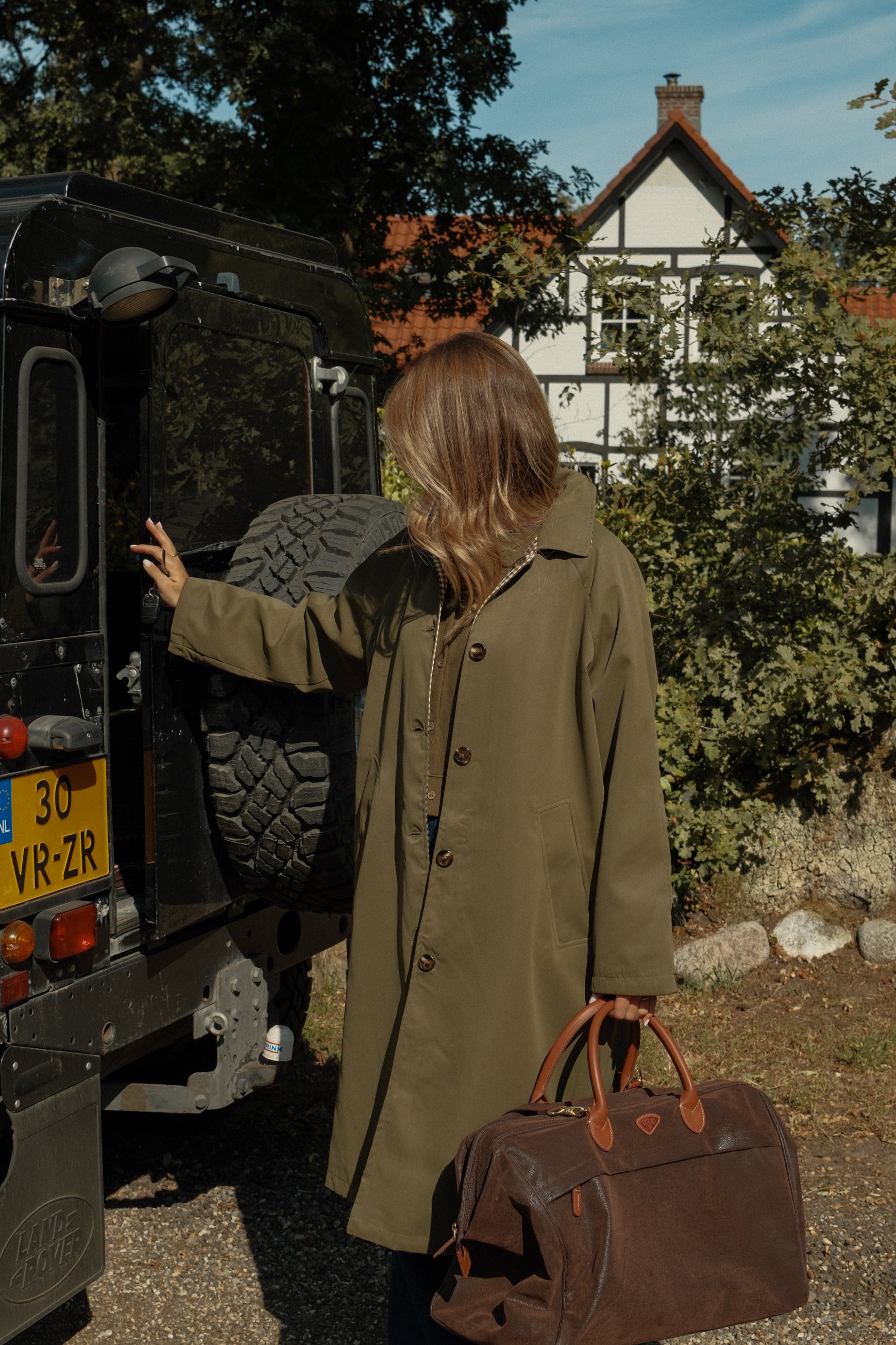 THE REVERSIBLE CHECK TRENCH COAT GREEN